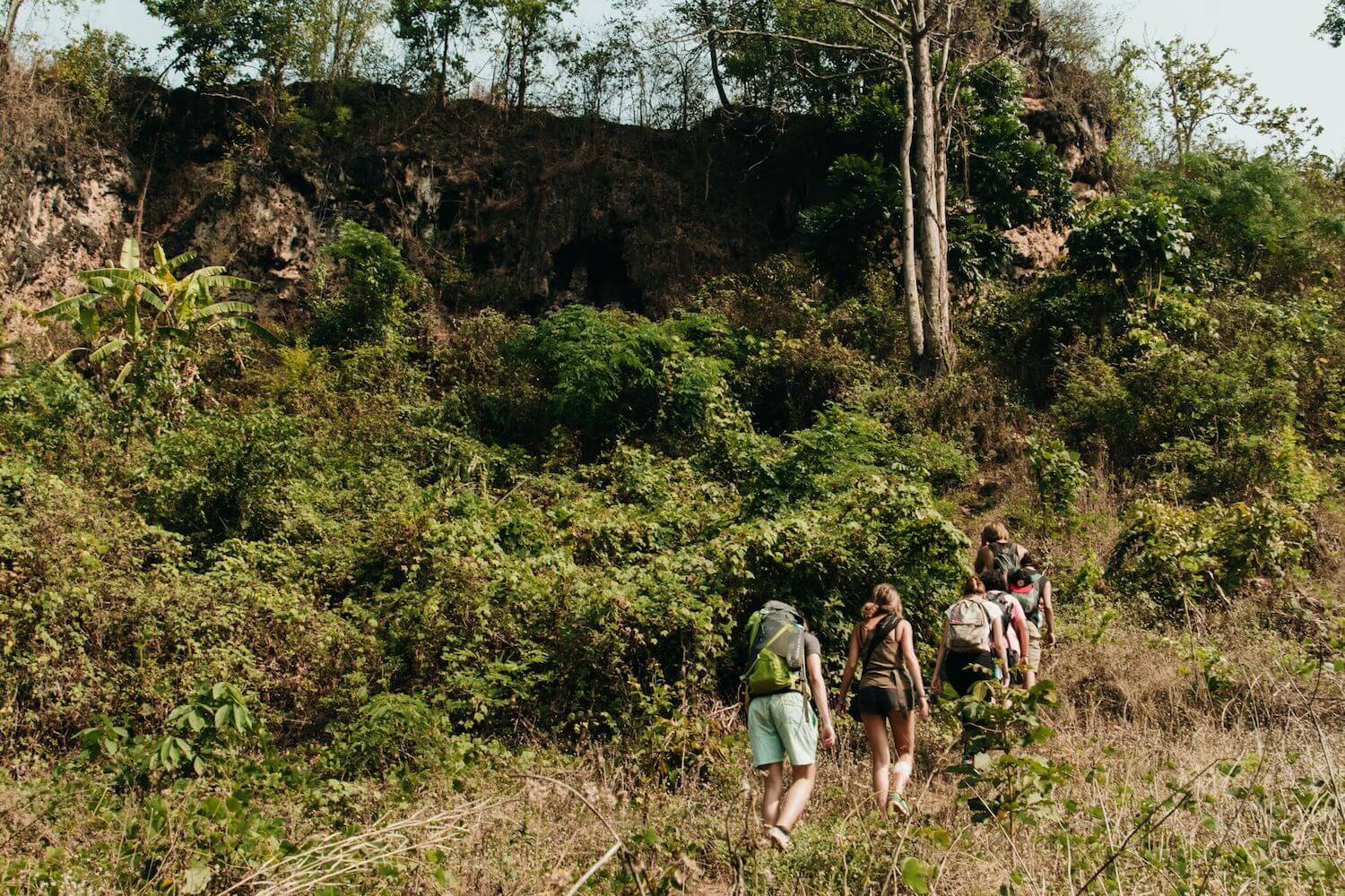 Best Myanmar Itinerary: Photo of people hiking through the Shan countryside from Hsipaw to a remote tea village in north Myanmar. Photo by Ryan Brown of Lost Boy Memoirs, edited in Lightroom.