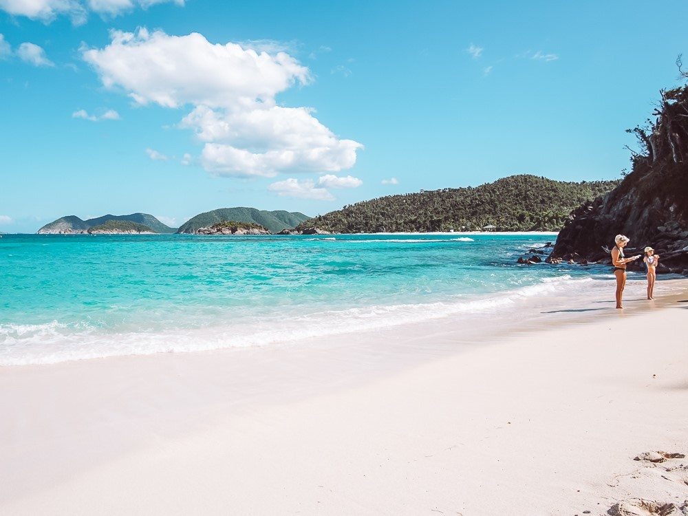 woman and child enjoying the quiet emptiness of jumbie bay in virgin islands national park