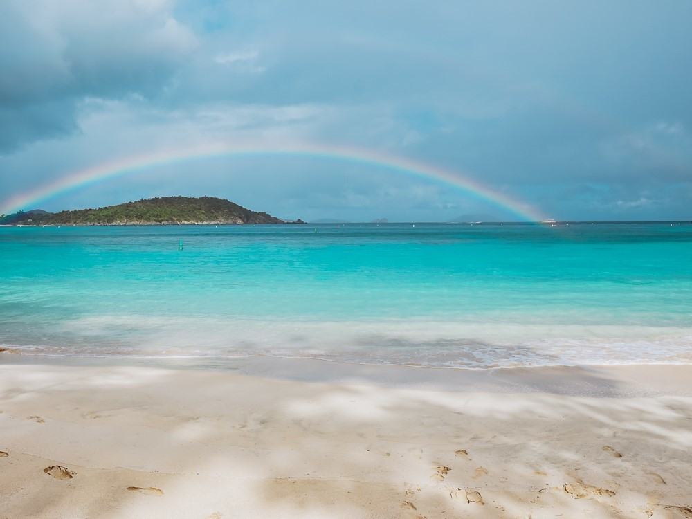 rainbow stretching across the distance from oppenheimer/gibney bay beach