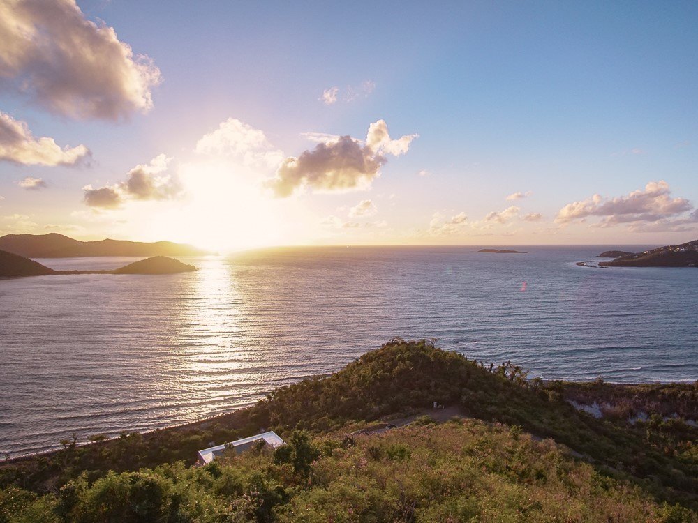 sunrise on horizon of coral bay in virgin islands national park