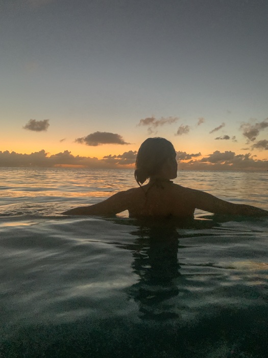 swimming at sunset in antigua