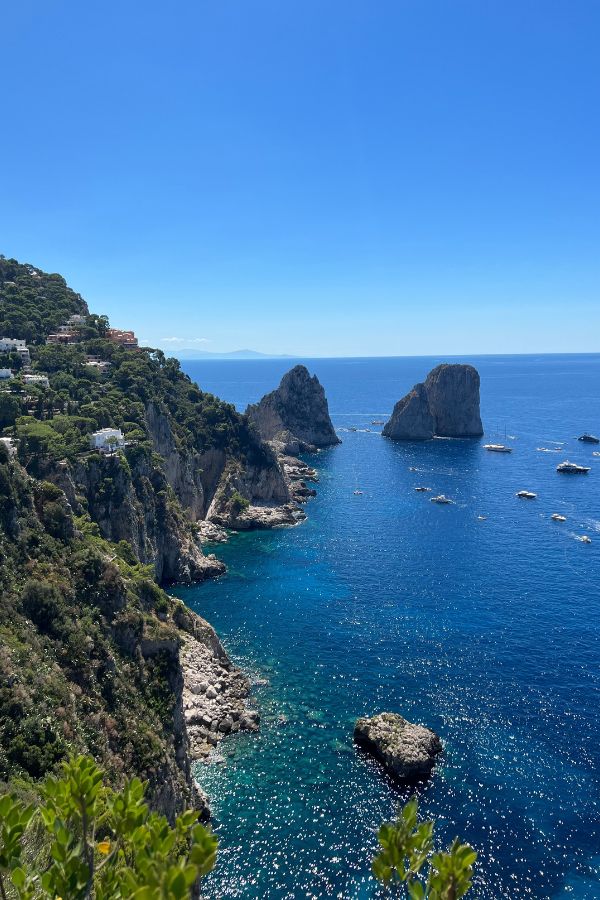 A view of Capri's rugged coastline and sparkling blue water.