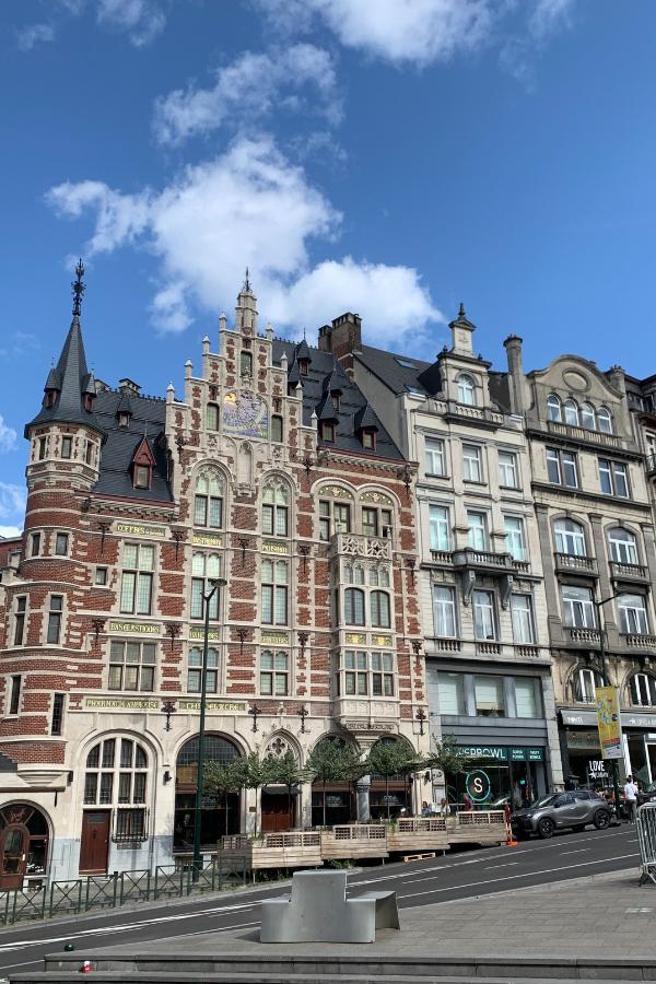 Traditional buildings in Brussels, Belgium packed tightly together on a road in the city center.