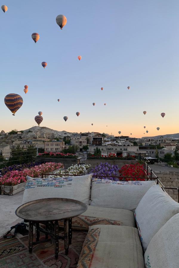 An early morning view of hot air balloons hovering over Goreme in Cappadocia, Turkey.