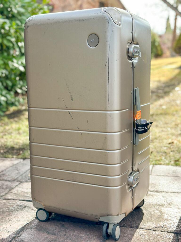monos luggage with scuffs